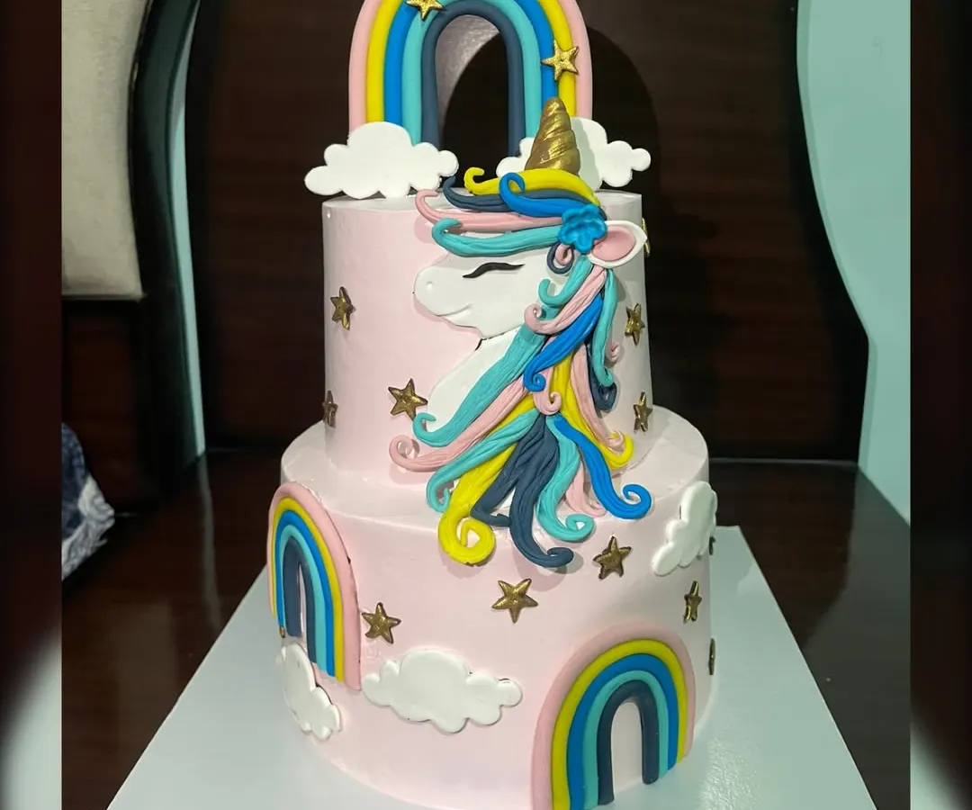 I love bringing magical themes to life, like this two-tiered unicorn cake for a special birthday girl. This custom eggless cake features colourful fondant rainbows, clouds, and a beautifully crafted unicorn, making it a dream come true for any kids' party in Gurgaon.