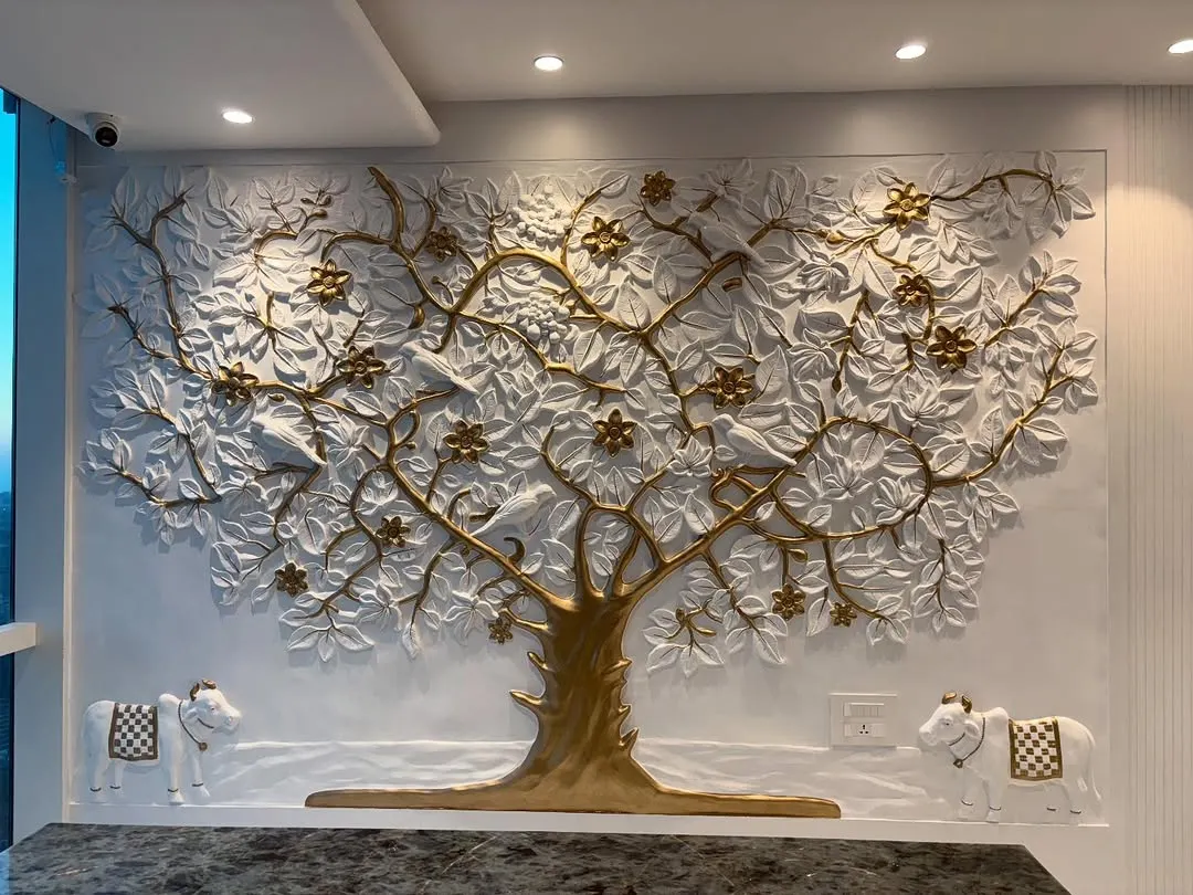 I designed this Kalpavriksha tree as a symbol of prosperity and creativity for a main office room. It's a custom 3D fibre mural with gold and white detailing, creating an incredible backdrop for the company's leader.