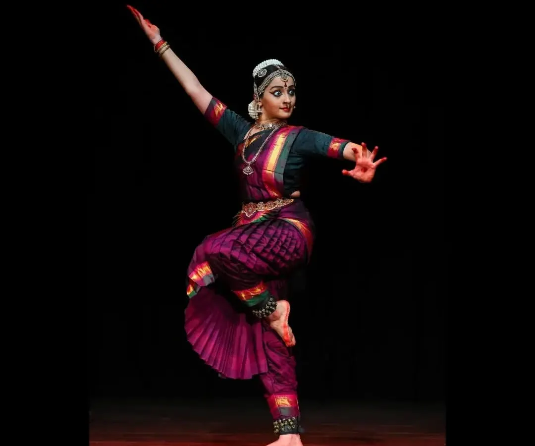This is a dynamic pose from a traditional Bharatanatyam Margam, showcasing the energy and precision of the Thanjavur Bani style. The full araimandi (half-seated posture) and extended limbs are characteristic of the pure dance sequences, or Nritta, that I perform.