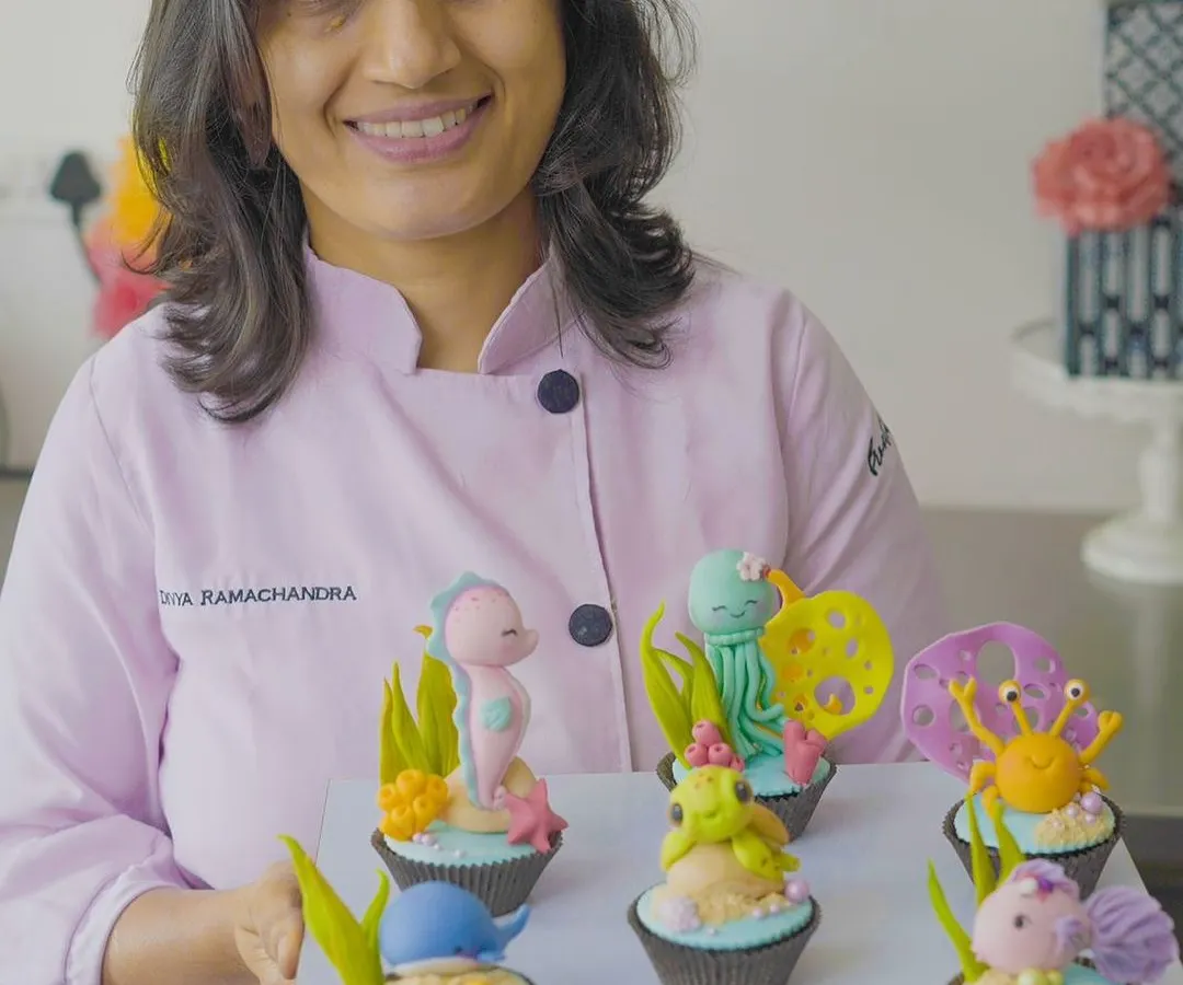 Holding a tray of finished cupcake toppers from one of my workshops! I love seeing the amazing creations my students make. My classes are designed to be friendly and relaxed, perfect for anyone wanting to learn.