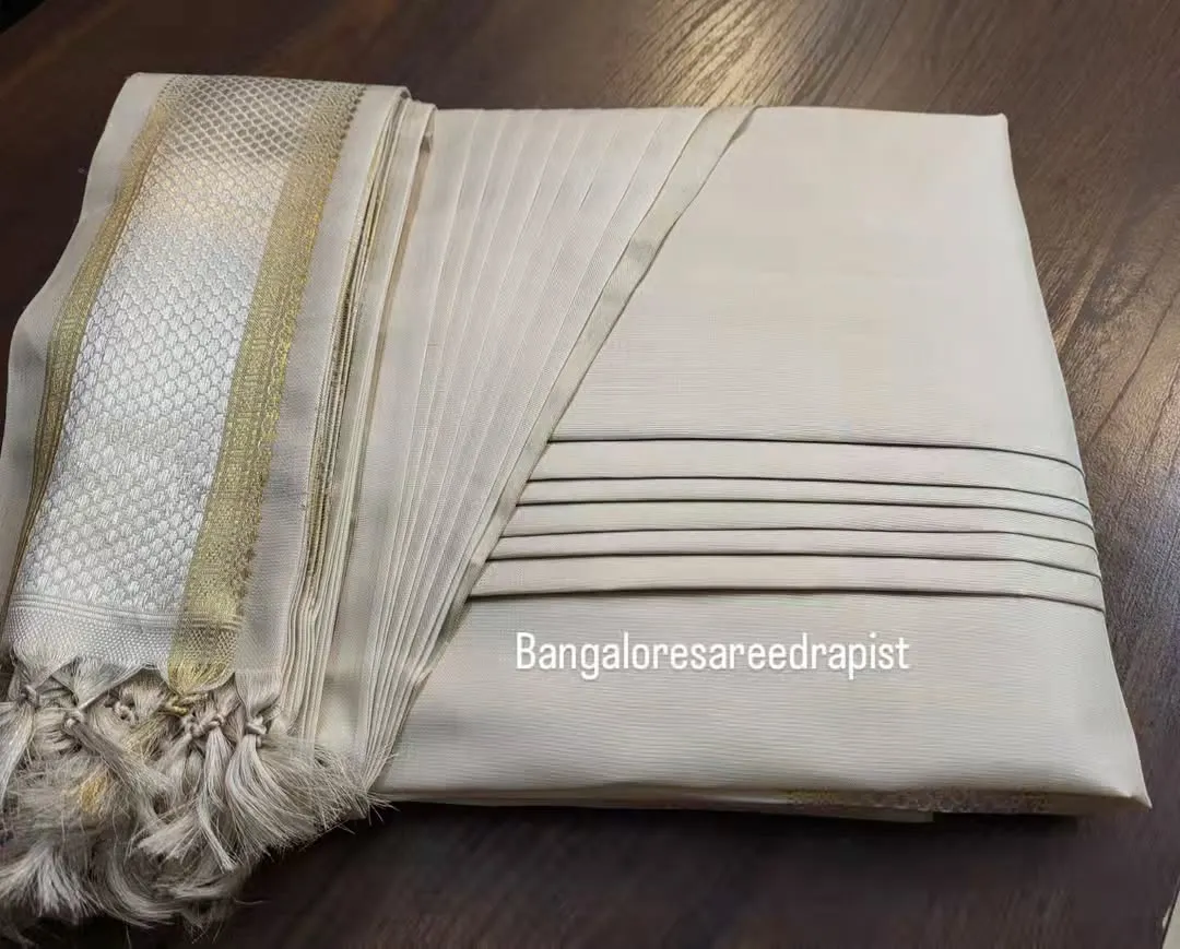 This is my signature box folding service, perfect for an engagement saree. The pleats are set and steam-pressed, and the saree is folded compactly, making it easy to store and ready to wear. This method protects the fabric and the pleats, whether you are storing it at home or traveling for a destination wedding.