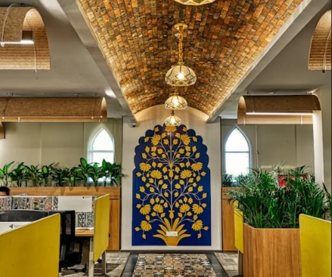 At the Miles Education office, I executed a design that blends rich Indian tradition with modern functionality. This view showcases the vaulted brick ceiling, intricate floor tiles, and custom "tree of life" wall art, all working together to create an inspiring atmosphere for learning.