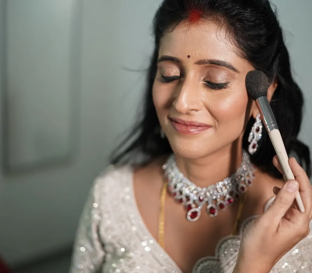 The magic is in the process. Here, I am applying a soft blush to enhance my client's natural glow. My one-on-one workshops are all about hands-on learning, where I guide you through each step on your own face.