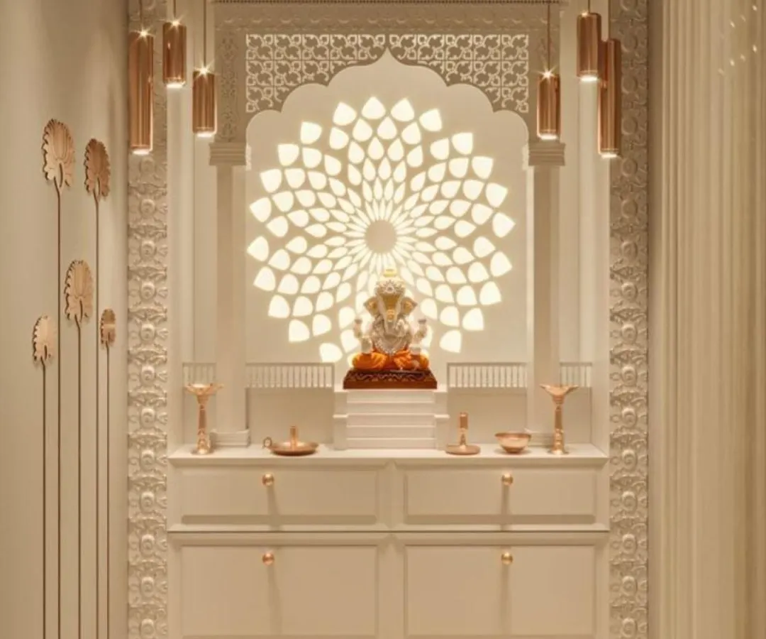An exquisite home mandir crafted from white material, featuring a backlit Ganesha against a lotus-petal-inspired backdrop. This design showcases our ability to blend spiritual motifs with contemporary aesthetics, creating a serene and luxurious sacred space.