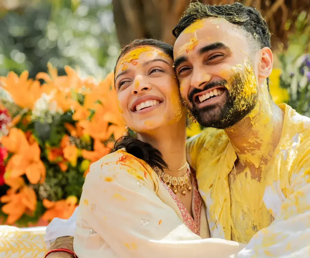 For me, it's all about capturing the pure, unscripted joy. This candid moment from Jay and Tavishi's Haldi, with smiles that light up the frame, is the essence of the happy memories I strive to create.