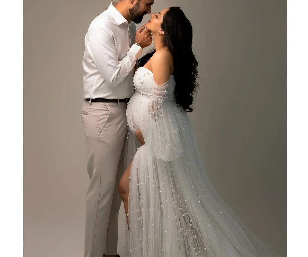 The quiet moments between two people before they become three are so precious. This elegant couple's portrait captures the love and anticipation that fills the air during a maternity session.
