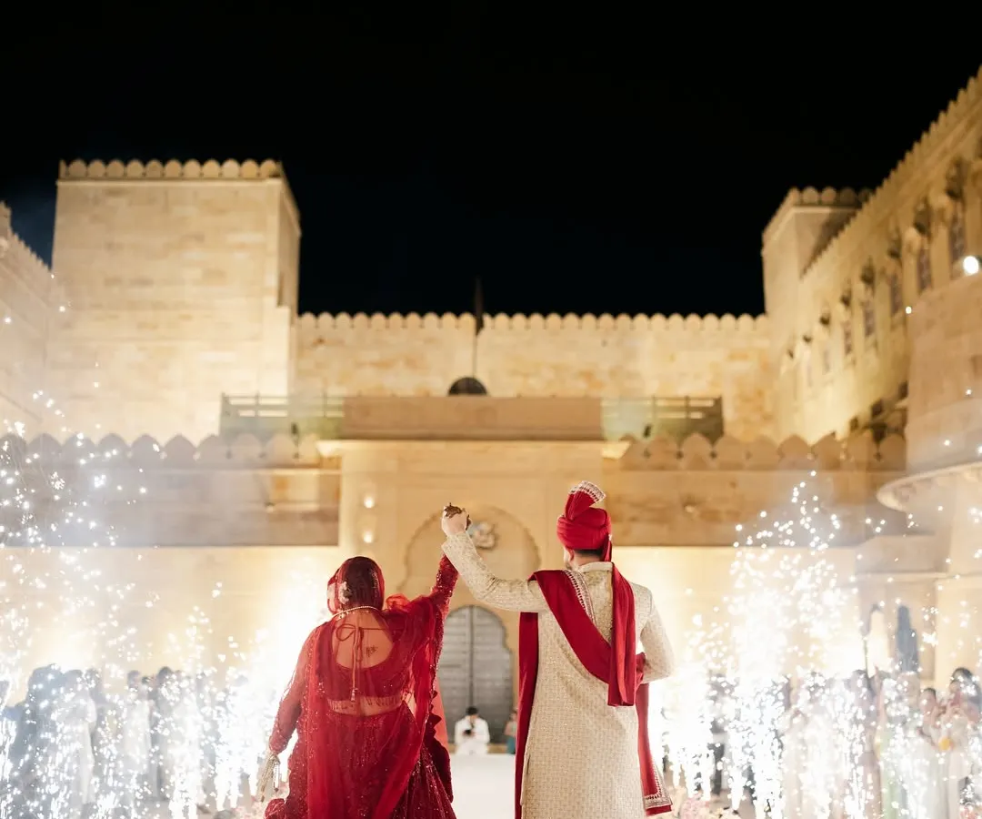 For this couple, the dream was a quietly royal varmala, inspired by Sid & Kiara's wedding. Against the magnificent backdrop of Suryagarh palace, with a shower of cold pyros, I helped create a moment that was both minimal and magical.