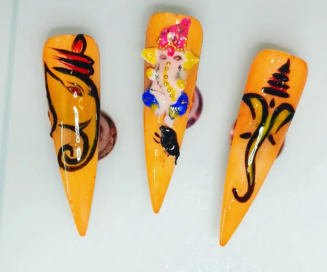 I am very proud of my custom Ganesha nail art, perfect for festivals. This set includes both detailed free-hand painting and a sculpted 3D Ganesha, showing the range of custom designs I can create for you on press-on nails.