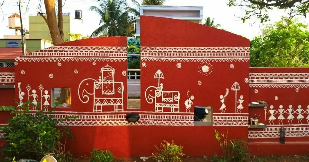 Bringing ancient stories to modern homes. This expansive Warli mural on an exterior compound wall uses traditional motifs to tell a story of village life, celebration, and culture. It’s more than just paint; it’s a piece of heritage that gives this home a powerful and unique identity.