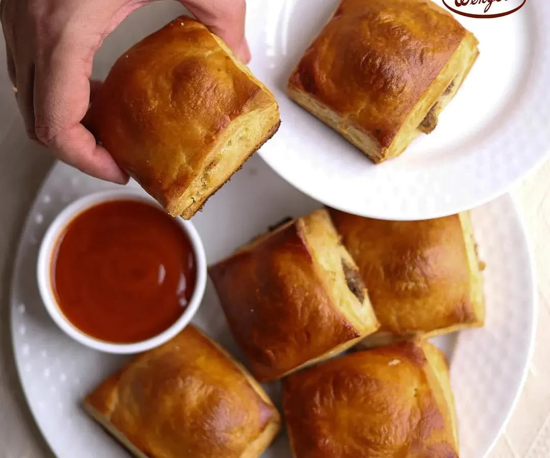 This is one of our most iconic snacks, the classic savory puff. Each one has a golden, flaky pastry shell that gives way to a delicious, warm filling. It's the perfect companion for your shaam ki chai or a quick bite on the go.