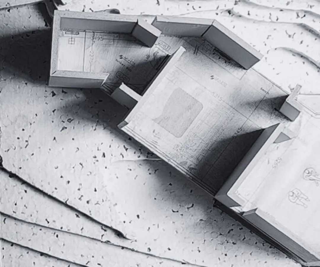 My process is rooted in craft. This physical study model shows the ground floor of a house designed for the hills, with the building's form embedded directly into the site's natural contours, demonstrating a harmonious integration of structure and landscape.
