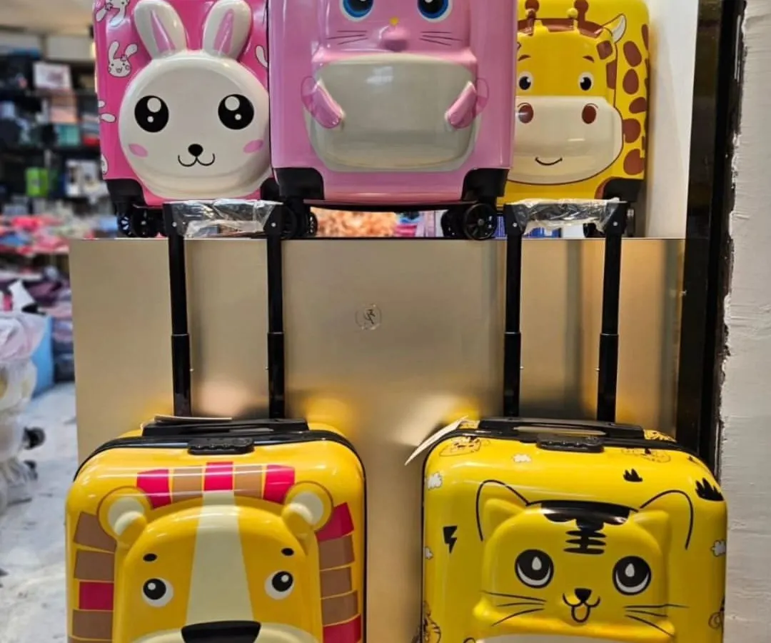 I've got these premium quality hard-shell trolley bags that make traveling a blast for kids. This shot shows some of the fun 3D animal designs available, including the lion, tiger, bunny, and giraffe.