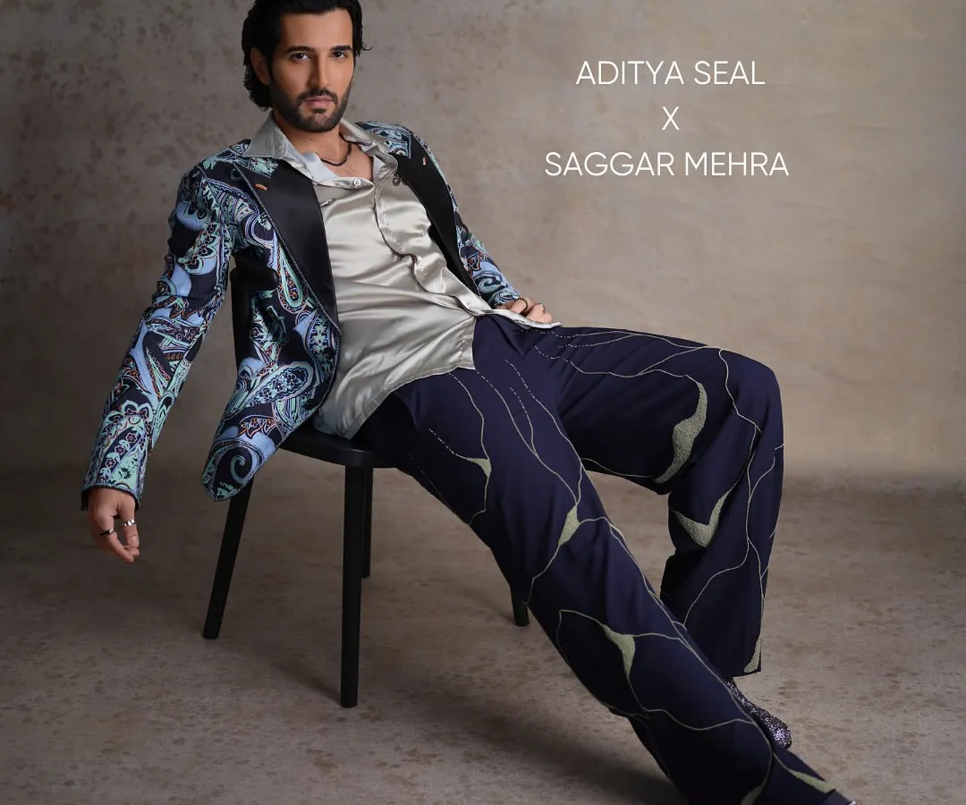 For Aditya Seal's feature in FHM India, I created this printed tuxedo to merge semi-formal sophistication with a relaxed charm. The look features a vibrant paisley print, a satin lapel, and uniquely patterned trousers, showcasing a bold approach to modern tailoring.