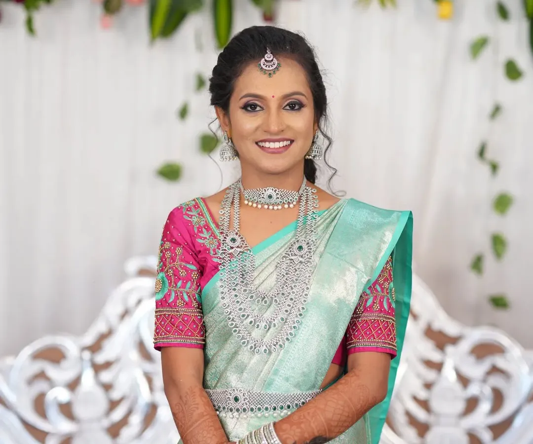 For a sparkling reception look, I recommend this stunning American Diamond jewellery set. The intricate design of the choker, long necklace, and matching earrings catches the light beautifully and pairs perfectly with modern sarees.