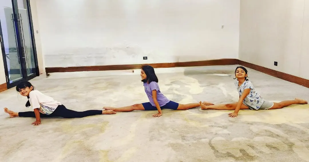 Look at this amazing display of teamwork and flexibility. Our students are practicing their middle splits together, motivating each other to reach their goals in a fun and supportive group setting.