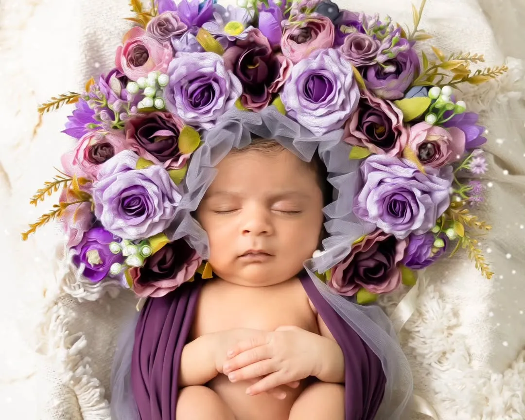 The pure innocence of a newborn. Our fine art newborn sessions are handled with the utmost care in our warm studio, using soft wraps and floral props to create timeless art.