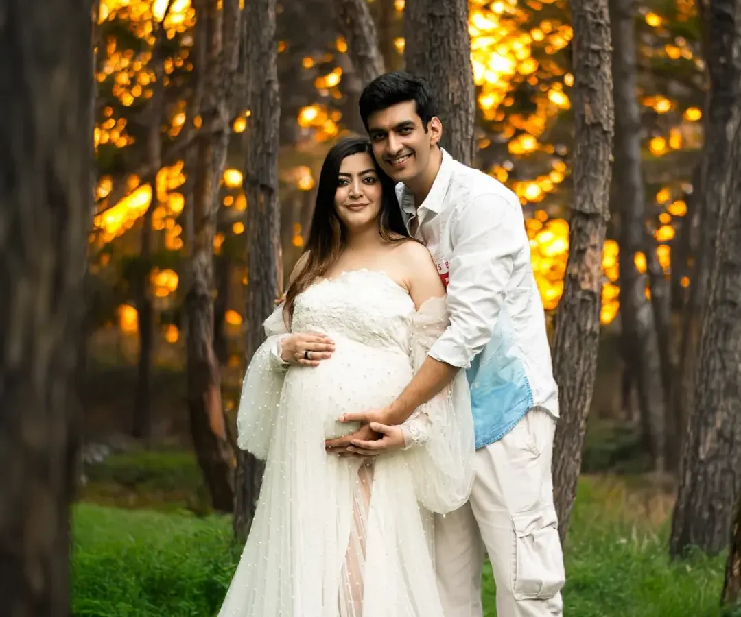 There's nothing like the magic of golden hour. This outdoor maternity session captures a couple's love in the warm, dreamy light of a forest setting, creating a truly romantic and timeless memory.