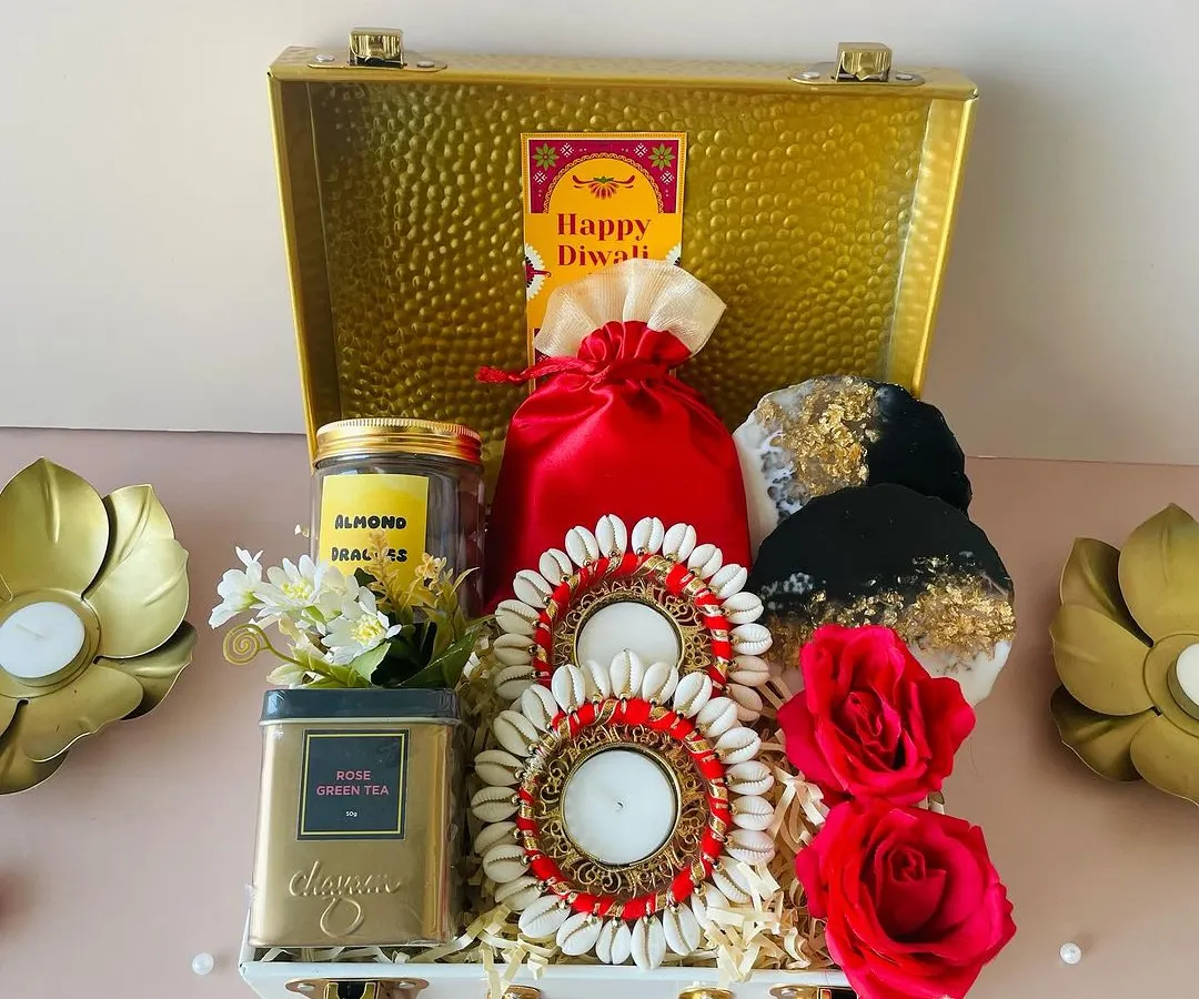 One of our bestsellers, this premium metal trunk hamper is the definition of affordable luxury. It's packed with Diwali delights like shell-work diyas and gourmet tea, making it a memorable gift for clients and employees.
