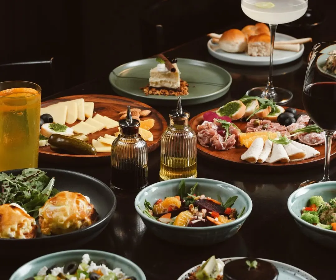 A glimpse of our lavish Sunday Brunch spread. This is more than a meal; it's a table full of stories waiting to be shared, featuring everything from fresh salads and artisanal cheese boards to decadent desserts.