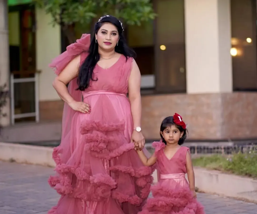 I love seeing families twin in my outfits. This beautiful mother and daughter are wearing my matching dusty rose gowns, a popular choice for family photoshoots, birthday parties, and special celebrations.