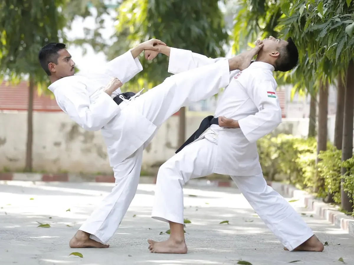 Here I am demonstrating a controlled Jodan Mawashi Geri, or head-level roundhouse kick, during a Kumite sparring drill. We practice these advanced techniques with full focus on safety and precision.