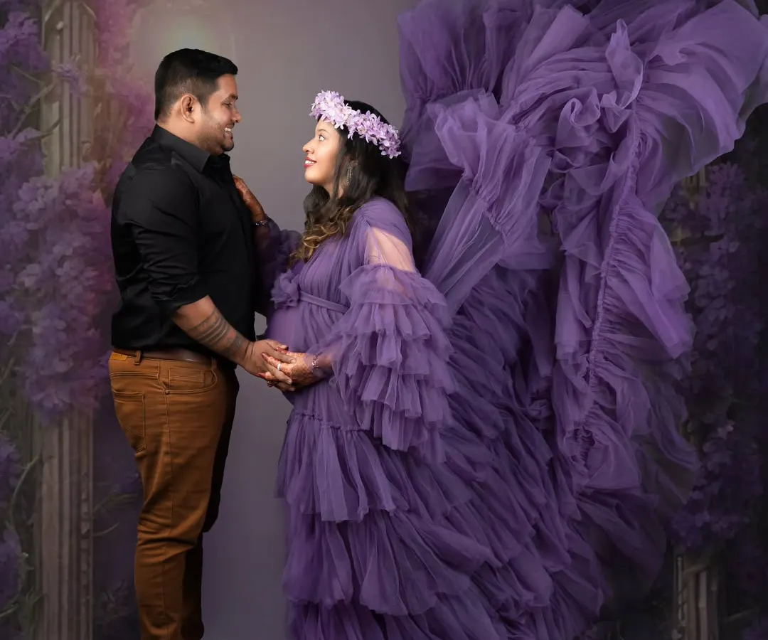 Creating a little bit of magic for your maternity session. This mother-to-be looks absolutely radiant in this flowing purple gown, set against a dreamy, enchanted forest backdrop that celebrates the fairy tale of new life.
