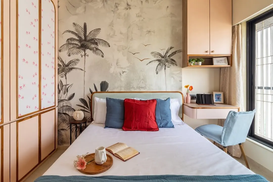 In this master bedroom, we blended romance and functionality. A custom botanical wallpaper creates a stunning feature wall, while the integrated study nook makes the most of a compact layout, proving that you never have to sacrifice style for practicality.