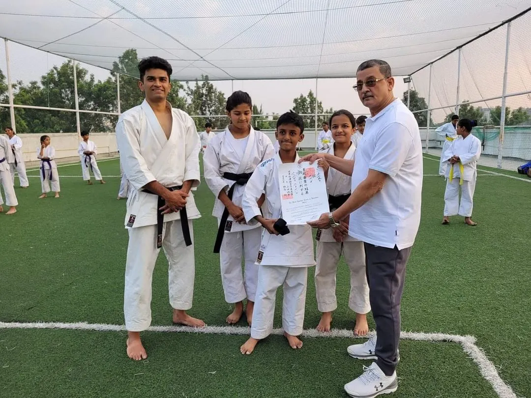 A proud moment as a student receives his official black belt (Shodan) certificate, sent all the way from the WSKF headquarters in Tokyo, Japan. This is the culmination of years of dedication.
