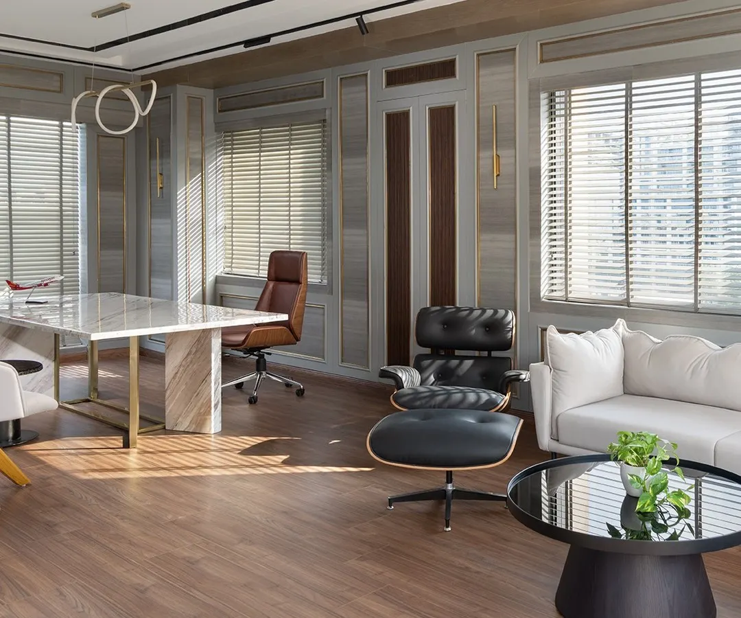 An executive cabin should be a statement of leadership and taste. In this space for EaseMyTrip's MD, I combined soft gray paneling with a commanding marble desk and iconic mid-century furniture. The result is a workspace that is both luxurious and highly functional, filled with natural light to create a calm, focused environment.