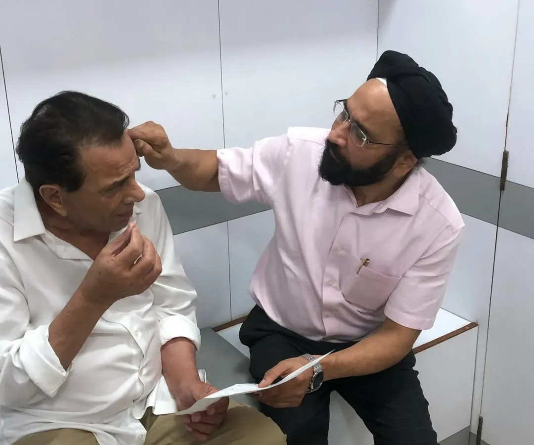 A proper diagnosis is the most critical first step. Here, I am conducting a detailed hair and scalp examination for the legendary actor Dharmendra. Before recommending any treatment, surgical or non-surgical, I need to understand the precise cause of hair loss.