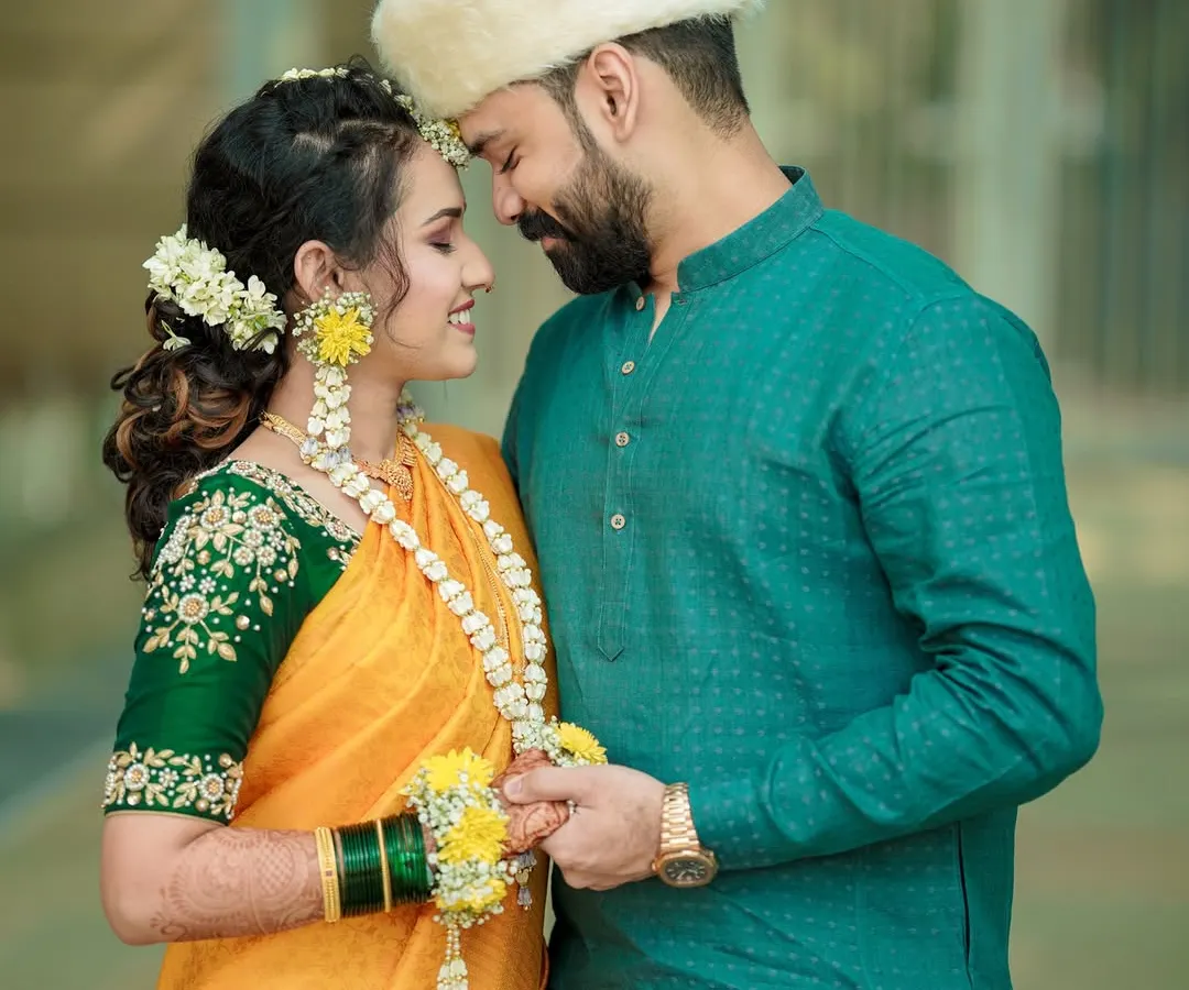 An intimate moment during a Maharashtrian pre-wedding ceremony. I focus on the quiet connections and traditional details that make your celebration unique, telling a story of love and heritage.