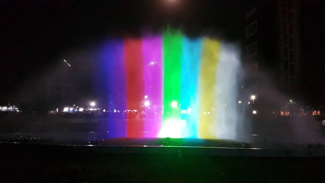 We transform water into a dynamic canvas for light and color. This image captures our water screen projection technology, where high-powered projectors display vibrant visuals onto a fine mist. The result is a stunning, holographic-like effect ideal for large-scale outdoor events, brand activations, and public festivals.