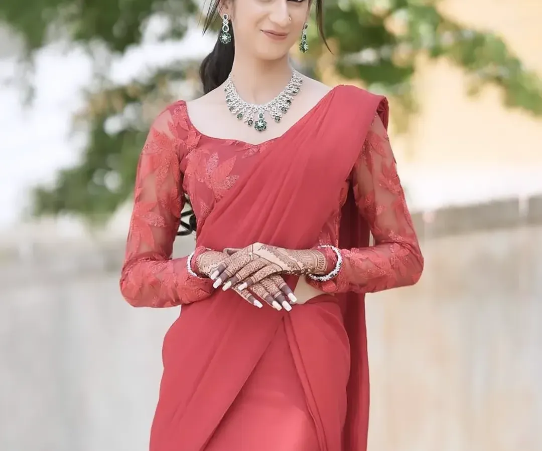 For this modern reception look, I created soft, glowing skin and paired it with a sophisticated hairstyle. The elegant red saree and diamond jewelry complete this stunning party-ready appearance.