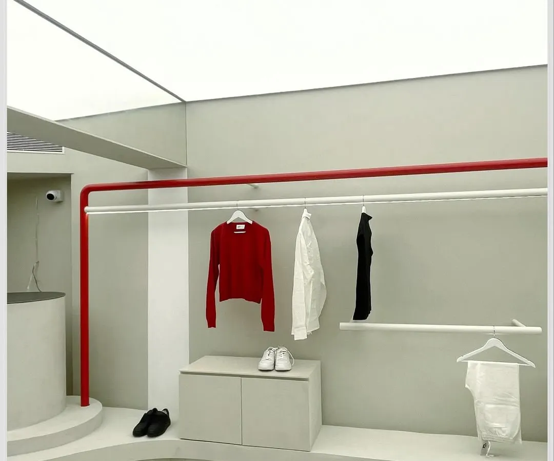 For the ARKS flagship store, we translated the brand's ethos of simplicity and authenticity into a physical space. The design uses a neutral palette with strategic pops of red, creating a clean, uncluttered environment where the apparel and products are the main focus.