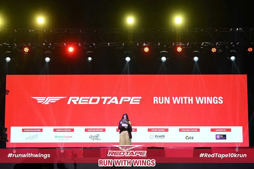 Your brand, front and center. This is the main stage at the RedTape 10K, where the brand's identity is the undeniable focal point. I ensure every visual element, from the largest screen to the smallest detail, reinforces your message with power and clarity.