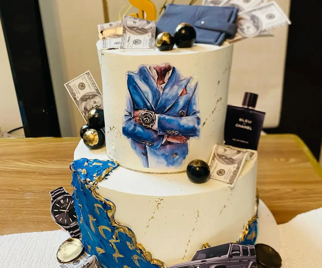 For those who appreciate the finer things, this two-tier luxury themed cake is a perfect choice. It's a multi-layered experience with flavors like couverture chocolate with salted caramel, Nutella hazelnut, and strawberry compote, all coming together for an unforgettable taste.