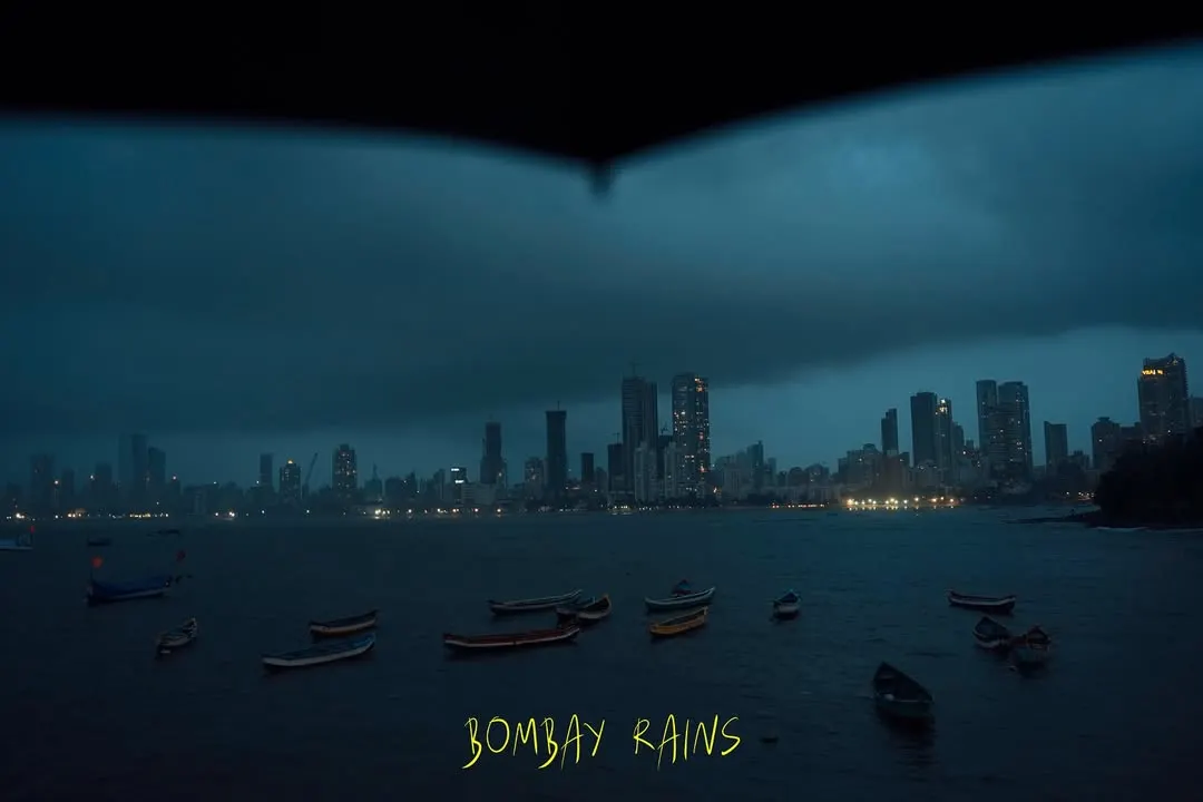 A classic moody evening during the Bombay rains. I framed this shot from under an umbrella to capture the dramatic skyline and the quiet boats, showing how the monsoon transforms the city into a beautiful, cinematic canvas.