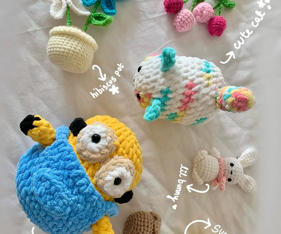 Here’s a little family photo of some of my favorite custom creations. You can see a Minion plushie, tiny potted plants that never wilt, a colorful cat, a bunny keychain, and floral charms. If you can dream it, I can probably crochet it.