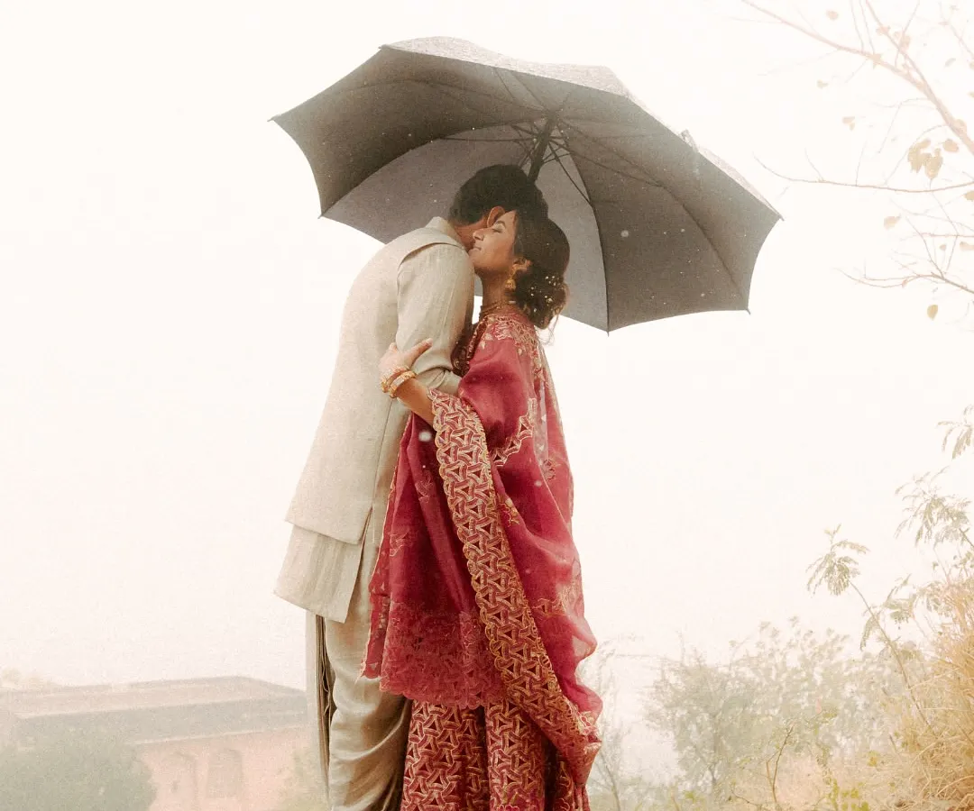 Unplanned moments are often the most precious. When the rain came, these two didn't run from it. They embraced it, and in that simple act of sharing an umbrella, they created a memory of pure, unscripted romance. I focus on capturing the heart of your story, even when nature has its own plans.