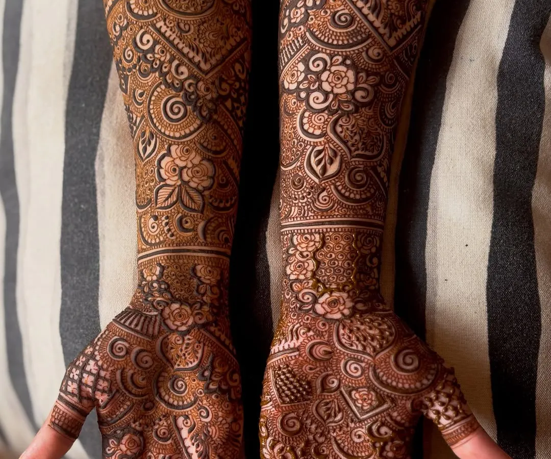 For this engagement bride, I designed a full-arm henna that combines traditional patterns with modern aesthetics. The fine linework and balanced composition ensure the design is both bold and elegant.