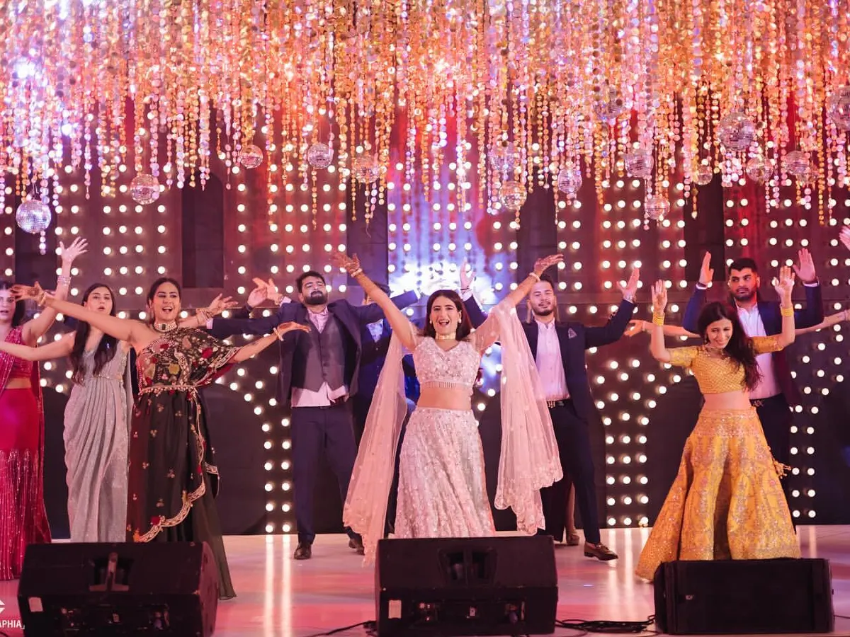 Look at that energy! This is what happens when the bride and her entire squad come together to own the stage. I love creating these full-scale group performances that get the whole crowd hyped.