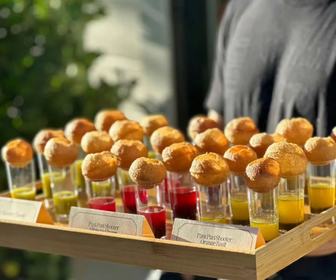 We've reimagined a street food classic with our Pani Puri Shooters. Each shot glass contains flavourful pani, topped with a crisp puri, making it a modern, mess-free appetizer perfect for any celebration.
