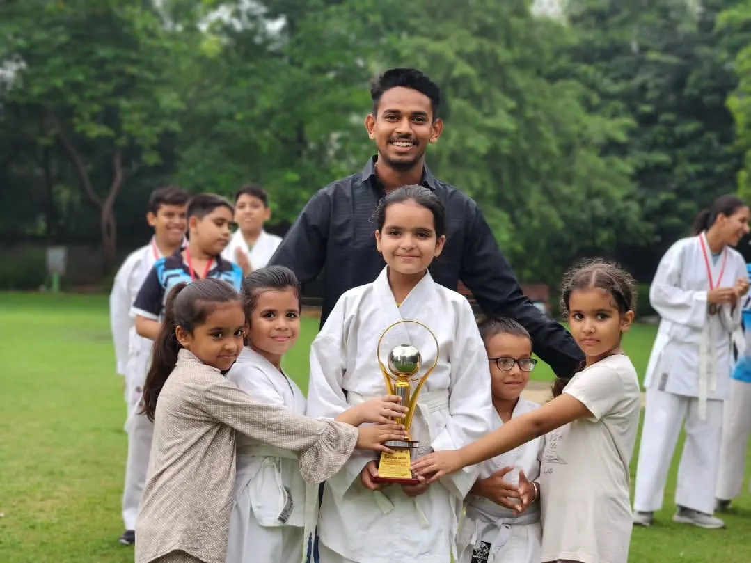 This trophy isn't just metal, it's proof of our collective hard work. I am incredibly proud of my young fighters who hold it high. We win as a family.