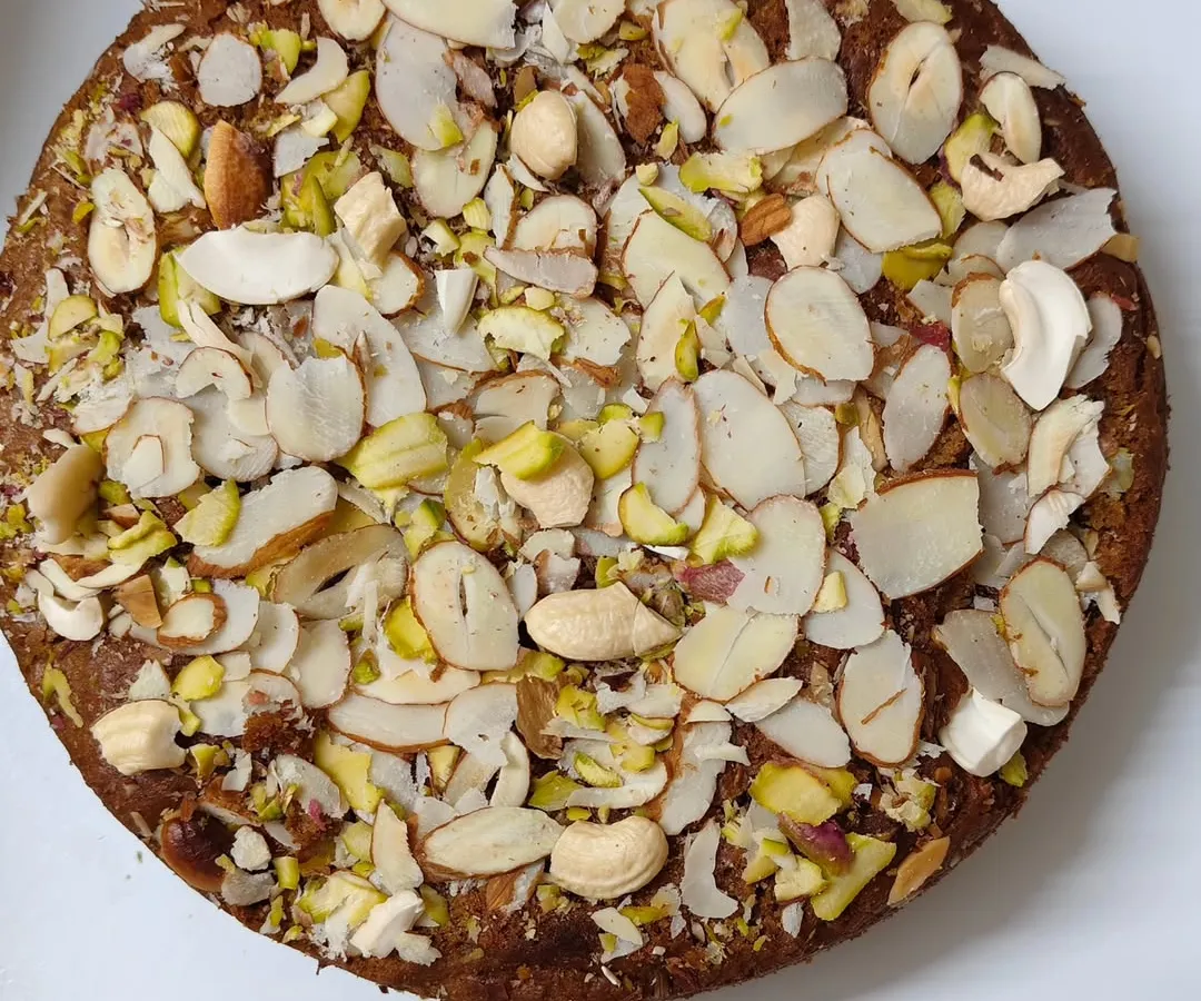 This is my Whole Wheat Jaggery Cake, and it's pure indulgence without the guilt. It's loaded with a generous amount of mixed nuts like almonds and pistachios, making it a perfect diabetic-friendly treat.