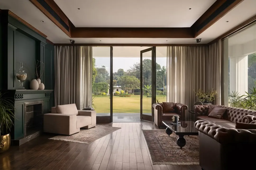 From the den of Mehalin Farm, the landscape becomes an extension of the living space. The design incorporates floor-to-ceiling glazing to frame the view and create a seamless transition between the curated interior and the natural exterior.