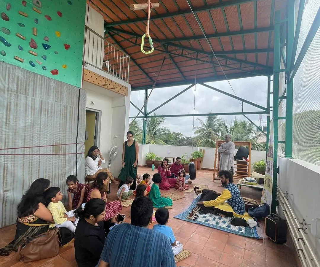 Welcome to our rooftop learning space. Here, children and adults gather to explore, create, and learn from one another in a sunlit, open-air environment surrounded by nature.