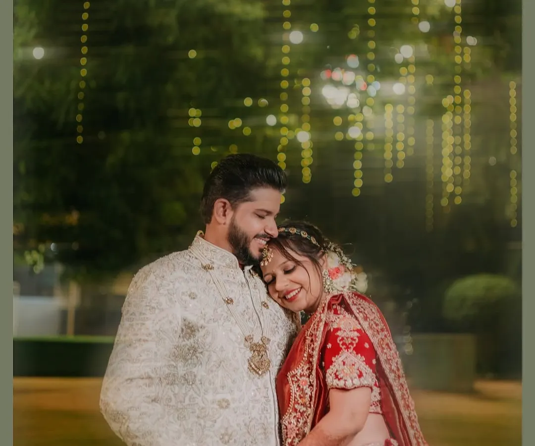 In the quiet moments after the vows, the real story unfolds. I focus on capturing the gentle, unscripted connections between a couple, like this tender embrace under soft lights. These are the portraits that you will cherish for a lifetime.