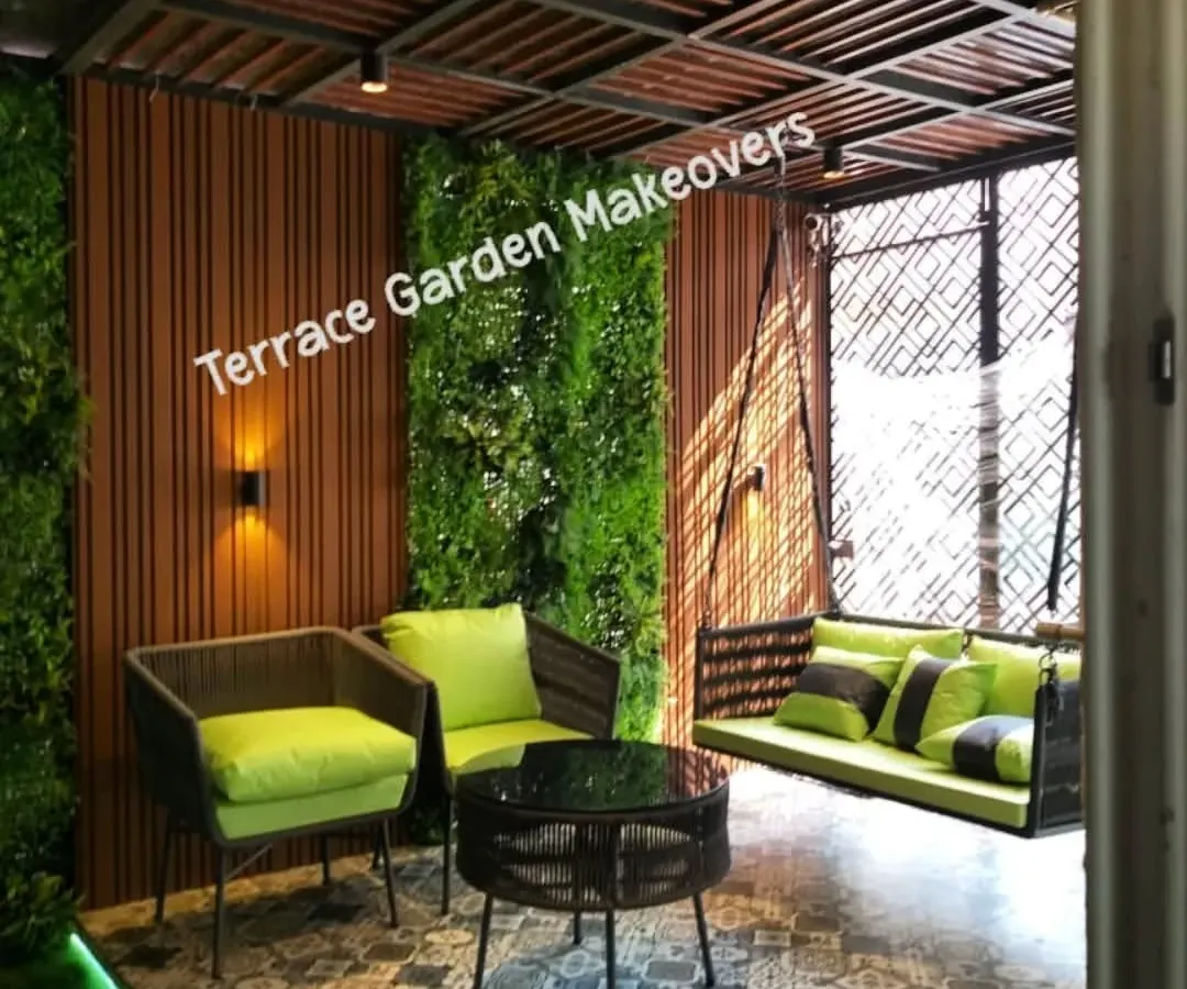 I designed this covered patio to be a perfect escape. It features comfortable seating, a relaxing swing, and lush artificial green walls, all under a stylish pergola, creating a cozy and elegant outdoor living room.