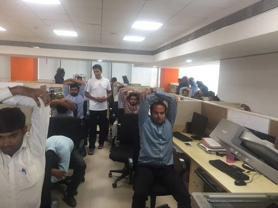 Leading a corporate yoga workshop, I guide office professionals through simple chair yoga stretches. These sessions are designed to be practical and accessible, helping to relieve desk-related stress, improve posture, and boost mental clarity right in the workplace.