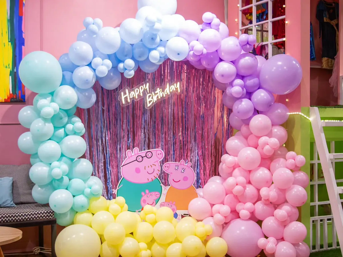 I love bringing cartoon worlds to life! This Peppa Pig theme features a custom pastel balloon arch and character cutouts for a fully immersive experience.